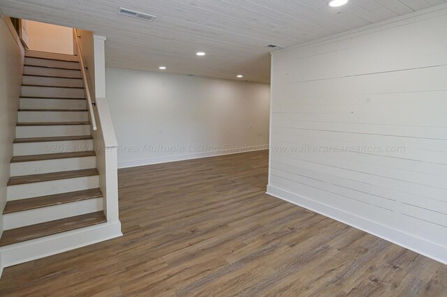 basement featuring dark hardwood / wood-style floors