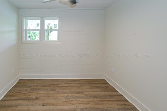 empty room featuring wood-type flooring