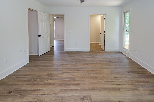 empty room with light hardwood / wood-style floors