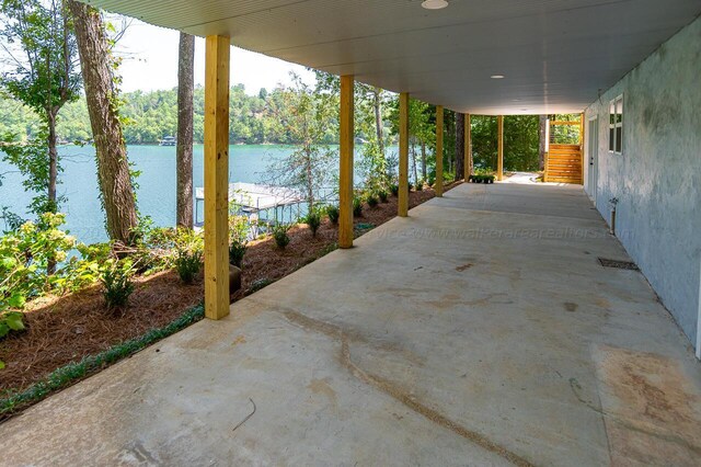 view of patio with a water view