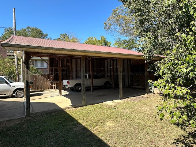 view of vehicle parking with a carport