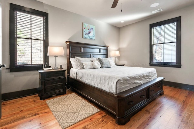 bedroom with ceiling fan and light wood-type flooring