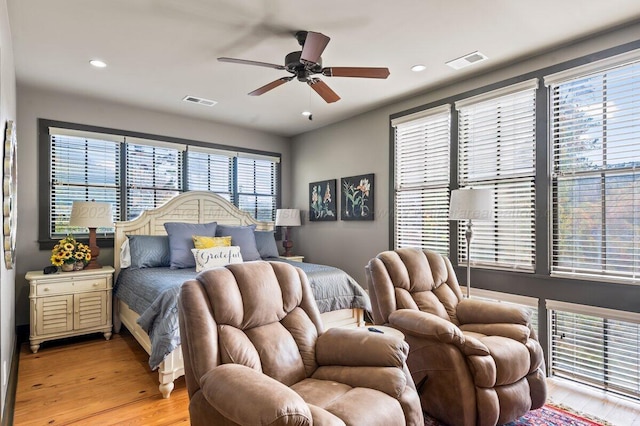 bedroom featuring light hardwood / wood-style floors and ceiling fan