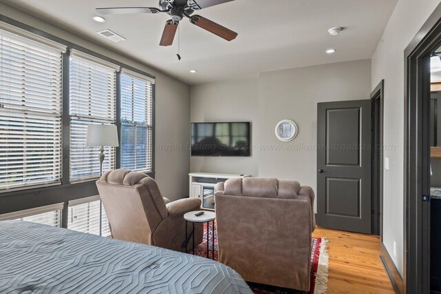 bedroom with ceiling fan and light wood-type flooring