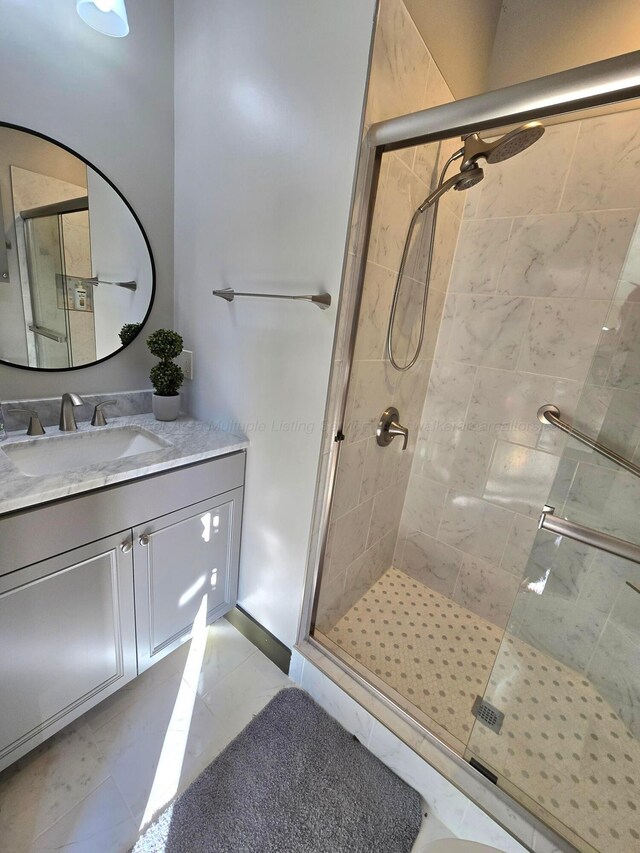 bathroom featuring vanity and walk in shower