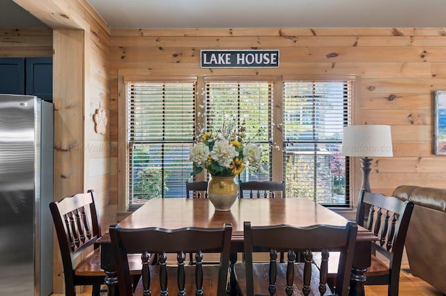 dining space with wooden walls