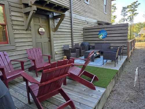 wooden terrace with an outdoor hangout area