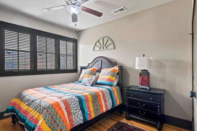 bedroom featuring ceiling fan and wood-type flooring