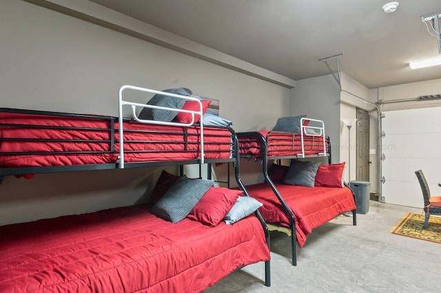 bedroom featuring concrete flooring