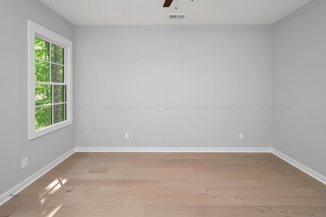 unfurnished room featuring ceiling fan and light hardwood / wood-style floors