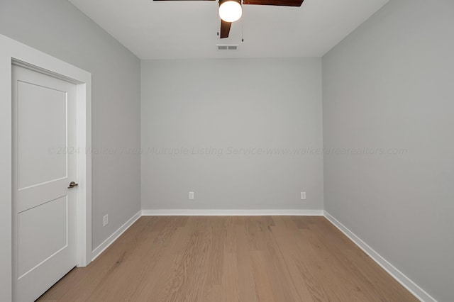 spare room with light hardwood / wood-style flooring and ceiling fan