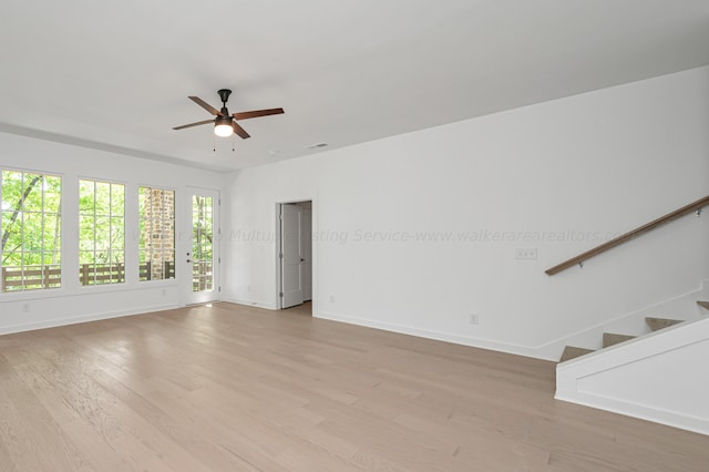 unfurnished room with ceiling fan and light wood-type flooring