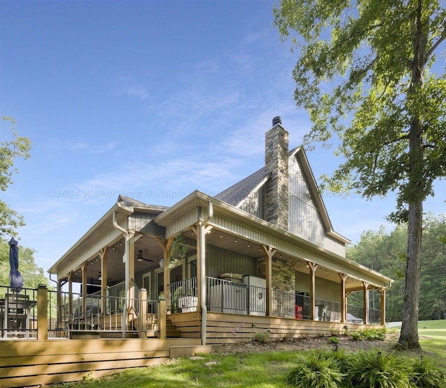 exterior space featuring ceiling fan