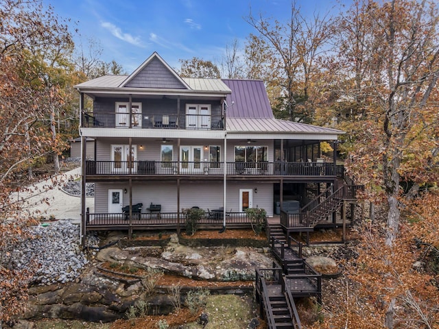 back of property with a balcony