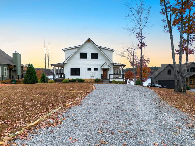 view of front of property with a porch and a garage