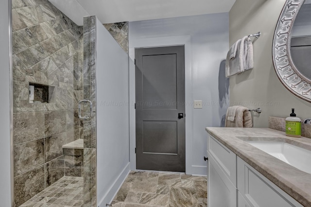 bathroom featuring vanity and a shower with shower door