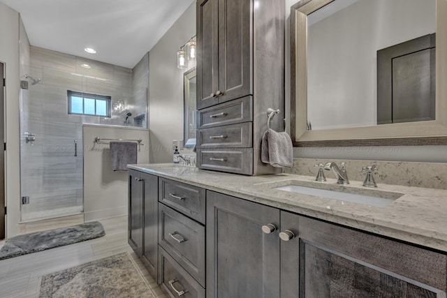 bathroom with hardwood / wood-style floors, vanity, and a shower with shower door