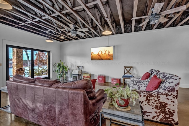 living room with ceiling fan and concrete floors