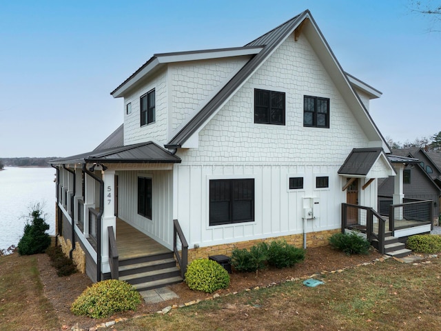 view of front of property with a water view