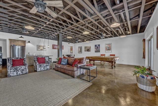 basement with ceiling fan, billiards, and stainless steel refrigerator