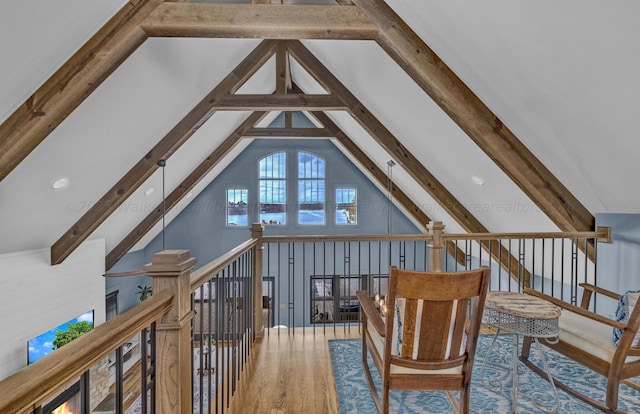 additional living space with hardwood / wood-style floors, beamed ceiling, and high vaulted ceiling