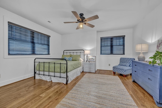 bedroom featuring ceiling fan and light hardwood / wood-style flooring