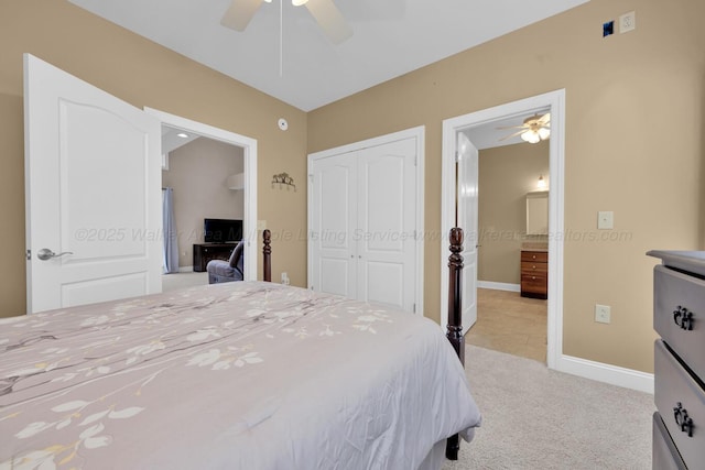 carpeted bedroom featuring ceiling fan and a closet