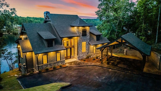 view of back house at dusk