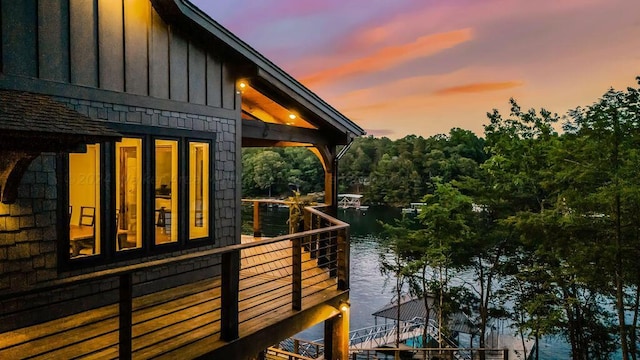 property exterior at dusk with a water view