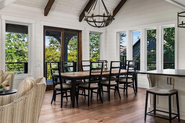 dining area with vaulted ceiling with beams and a healthy amount of sunlight