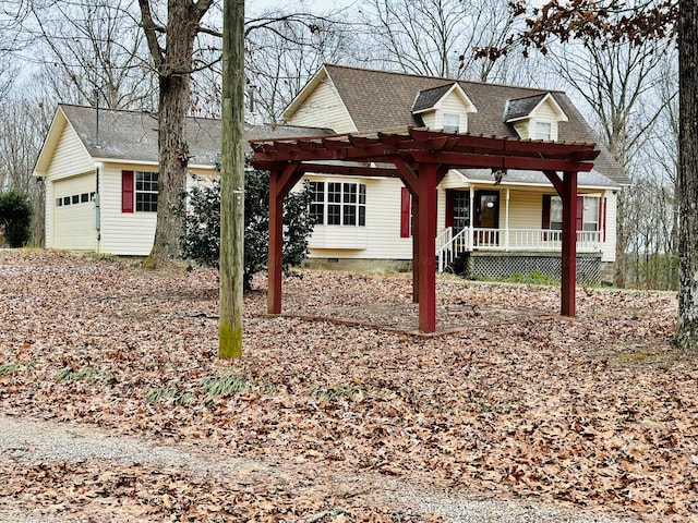 view of front of property featuring a porch, a garage, and a pergola