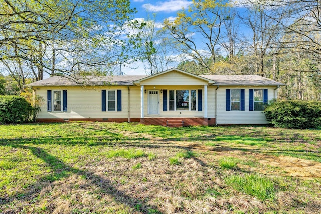 ranch-style house featuring a front lawn