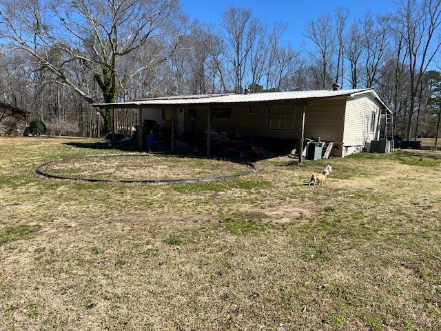 view of outdoor structure featuring central AC unit