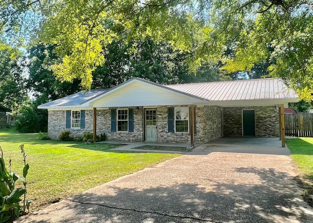 single story home featuring a carport, covered porch, and a front lawn