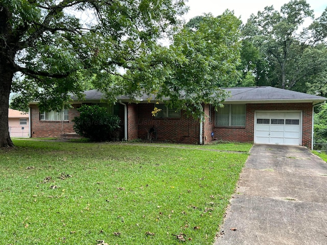 single story home with a garage and a front yard