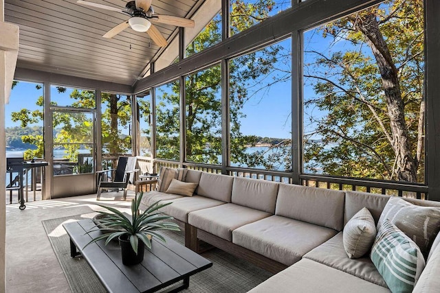 sunroom with ceiling fan, wooden ceiling, and vaulted ceiling