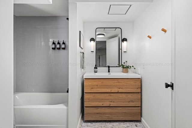 bathroom with vanity and tiled shower / bath combo