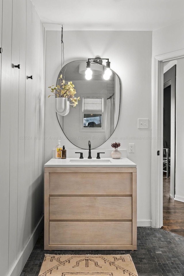 bathroom with hardwood / wood-style floors, vanity, and a shower with curtain