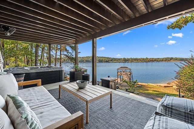 view of patio featuring outdoor lounge area and a water view