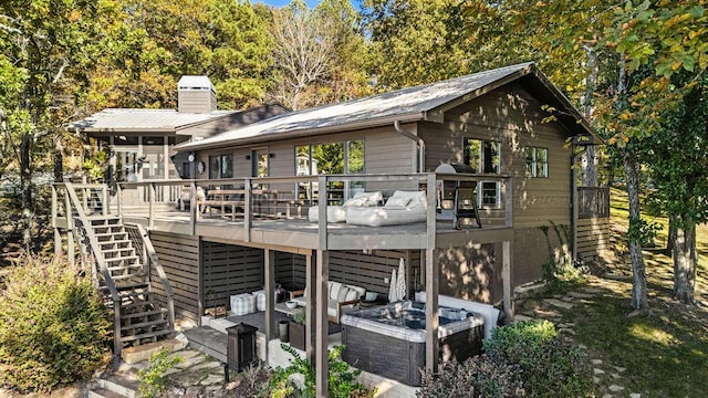 rear view of property featuring an outdoor hangout area and a deck