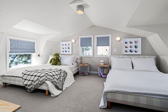 carpeted bedroom with vaulted ceiling