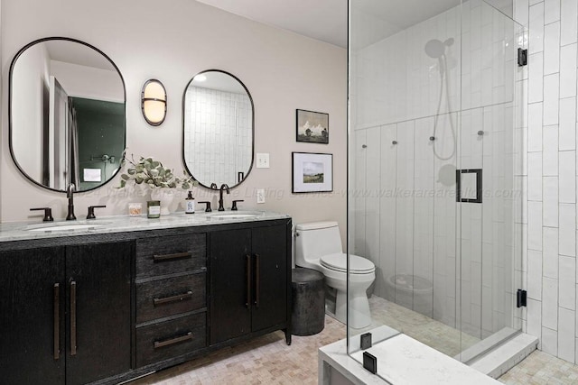 bathroom with walk in shower, vanity, and toilet