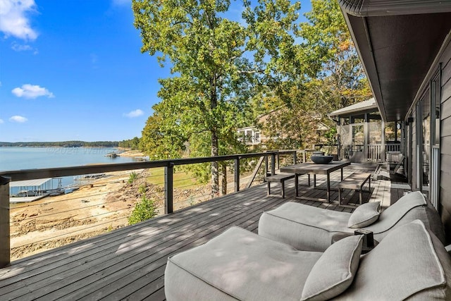 wooden deck with a water view