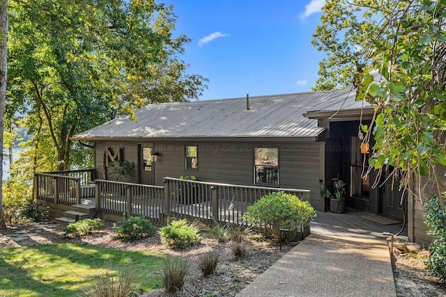 back of property featuring a wooden deck