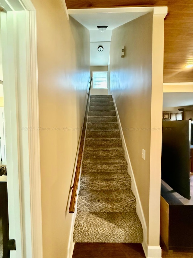 stairs featuring baseboards