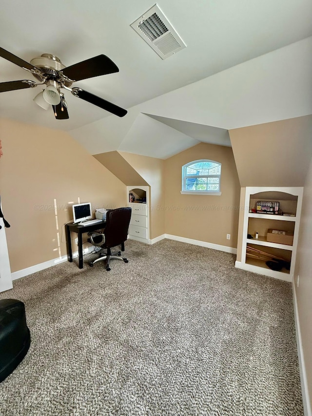 office featuring visible vents, carpet, and vaulted ceiling