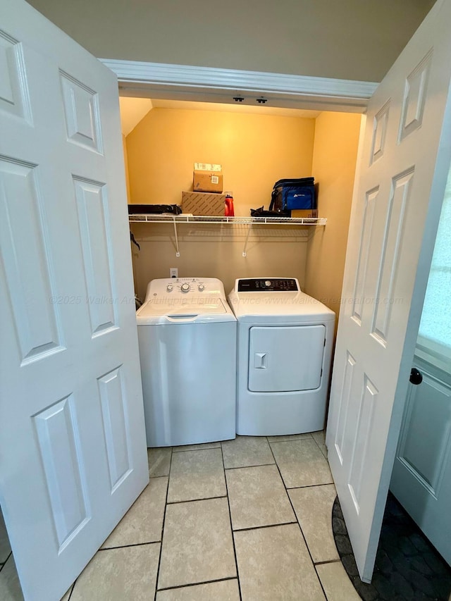 laundry room with light tile patterned flooring, laundry area, and washer and dryer