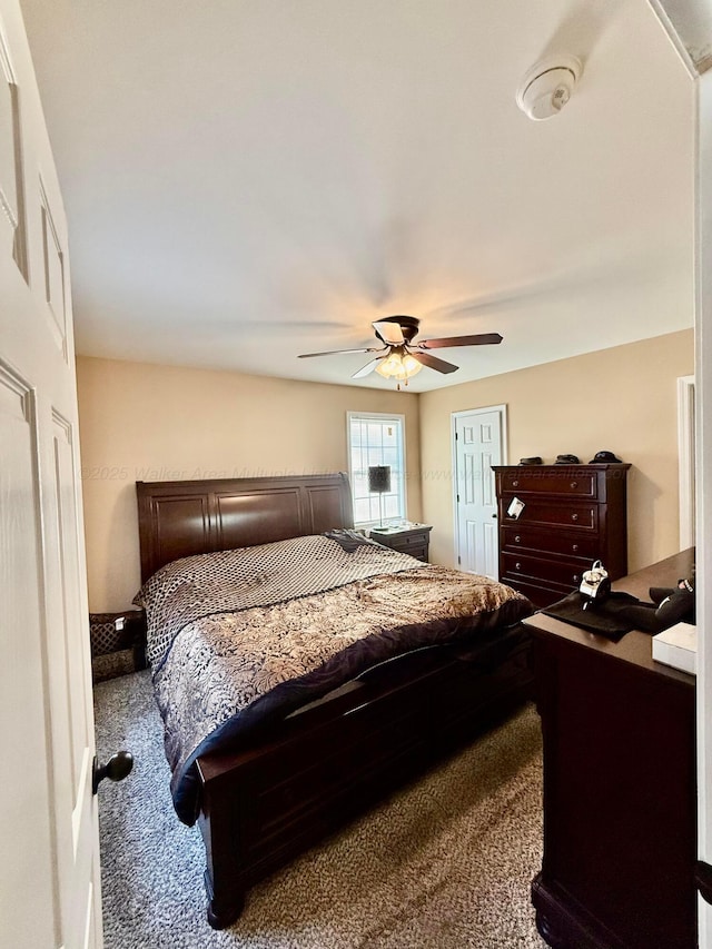 carpeted bedroom featuring a ceiling fan