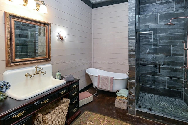 bathroom with wooden walls, vanity, and plus walk in shower