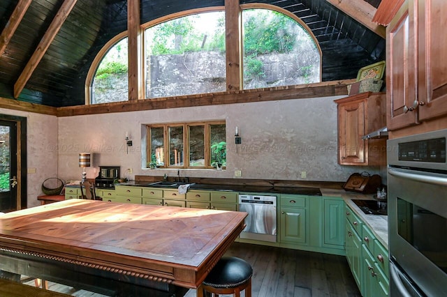 kitchen featuring appliances with stainless steel finishes, dark hardwood / wood-style flooring, sink, high vaulted ceiling, and beam ceiling